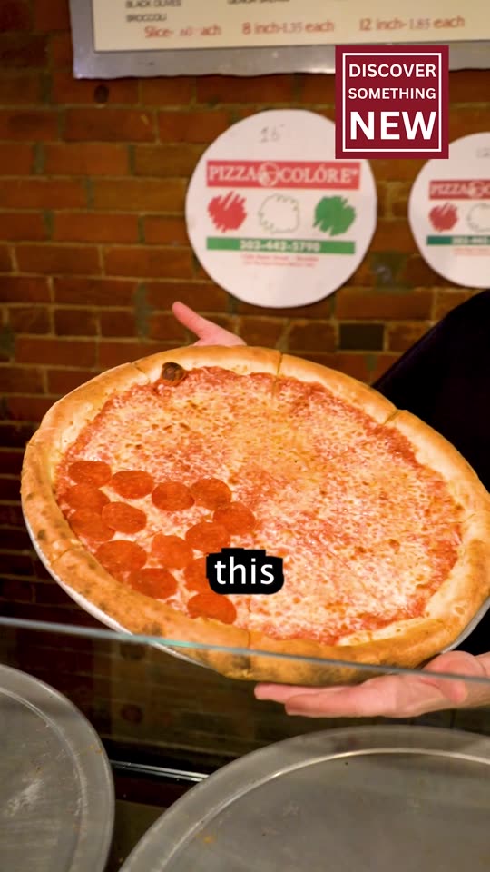 Frame from the pizza video at zero seconds, a pizza held up to the camera